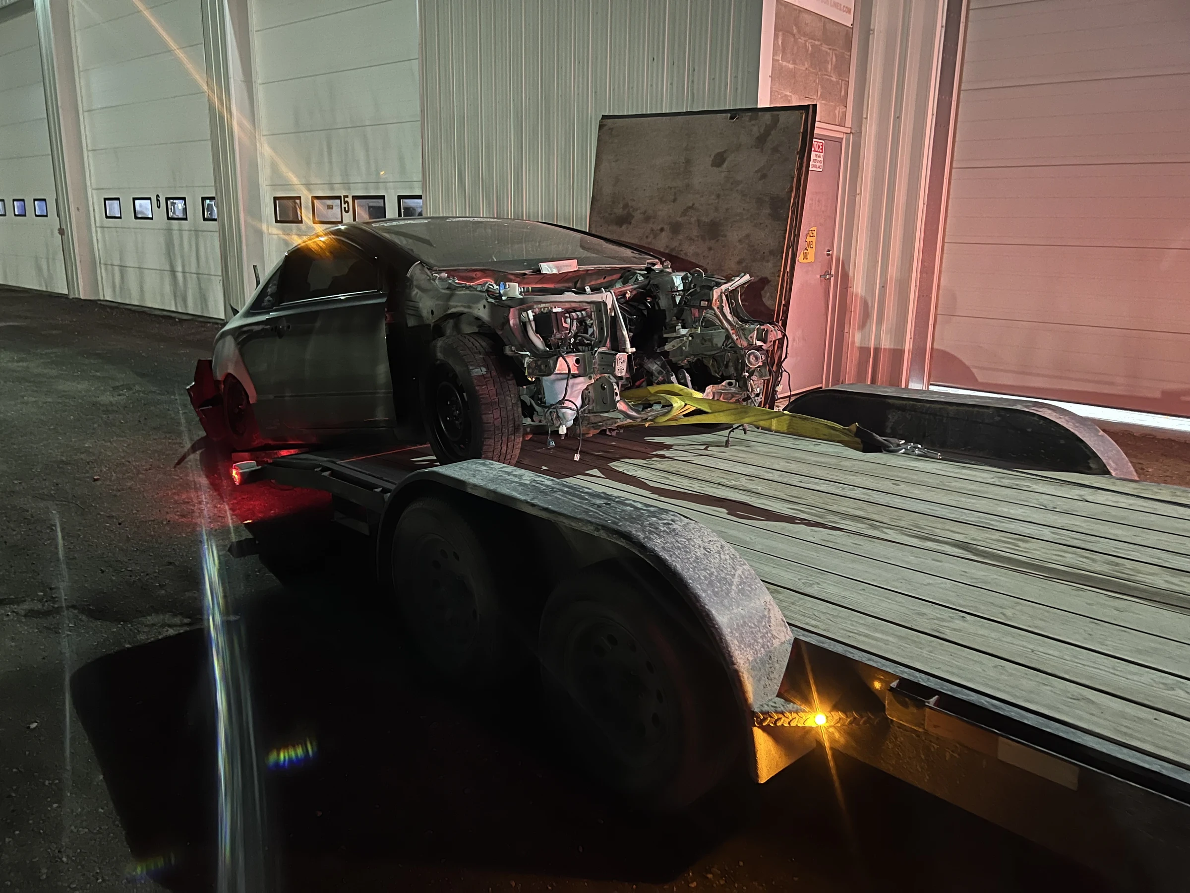 Damaged Car on Trailer