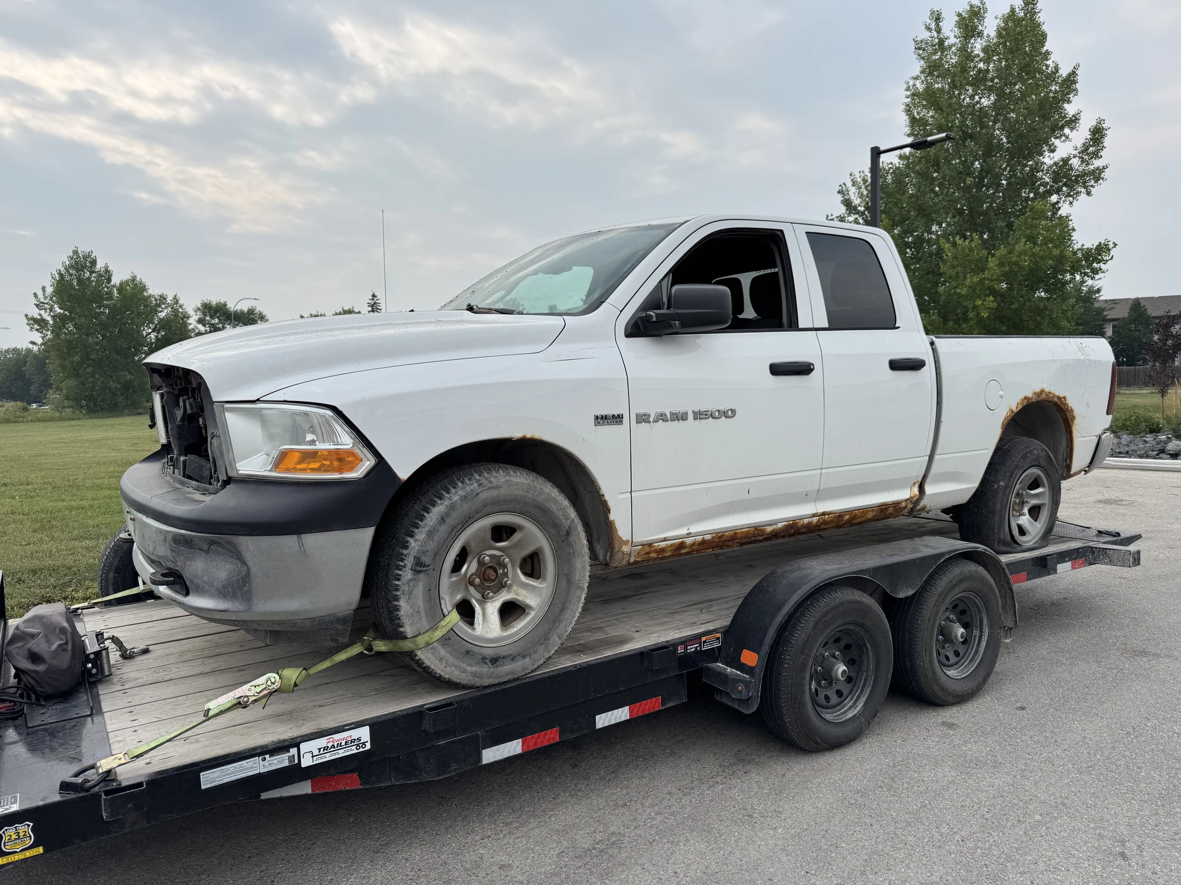 White Pickup Truck on Trailer
