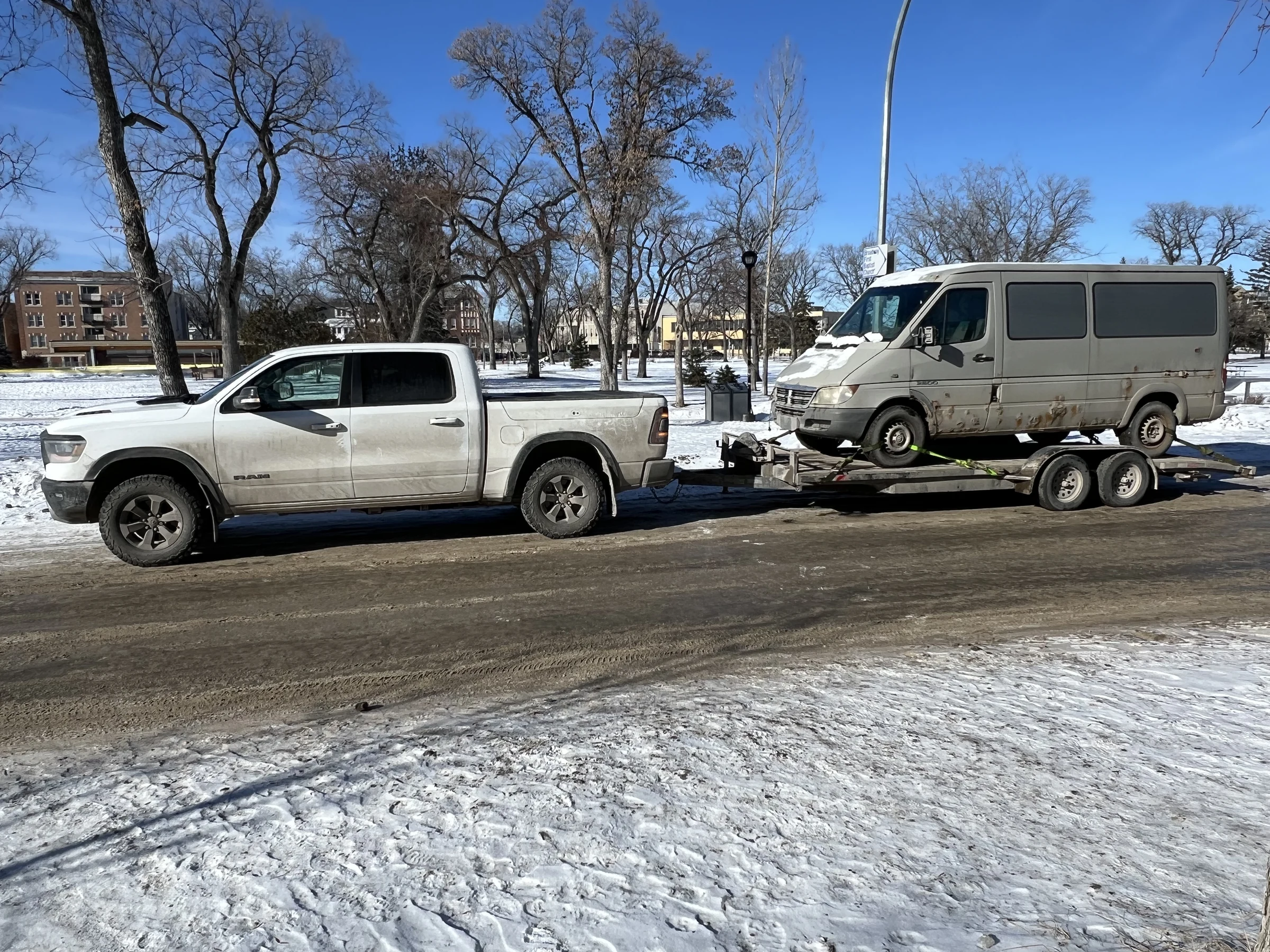 Truck Towing Van on Trailer