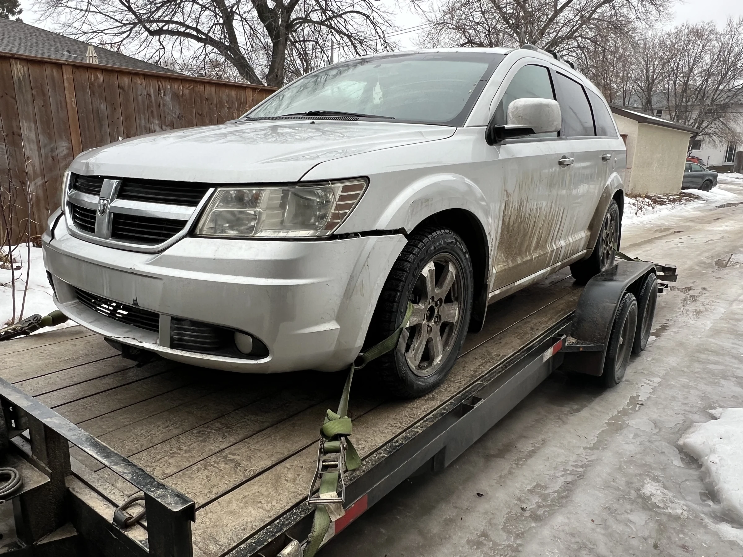 Silver Dodge on Trailer