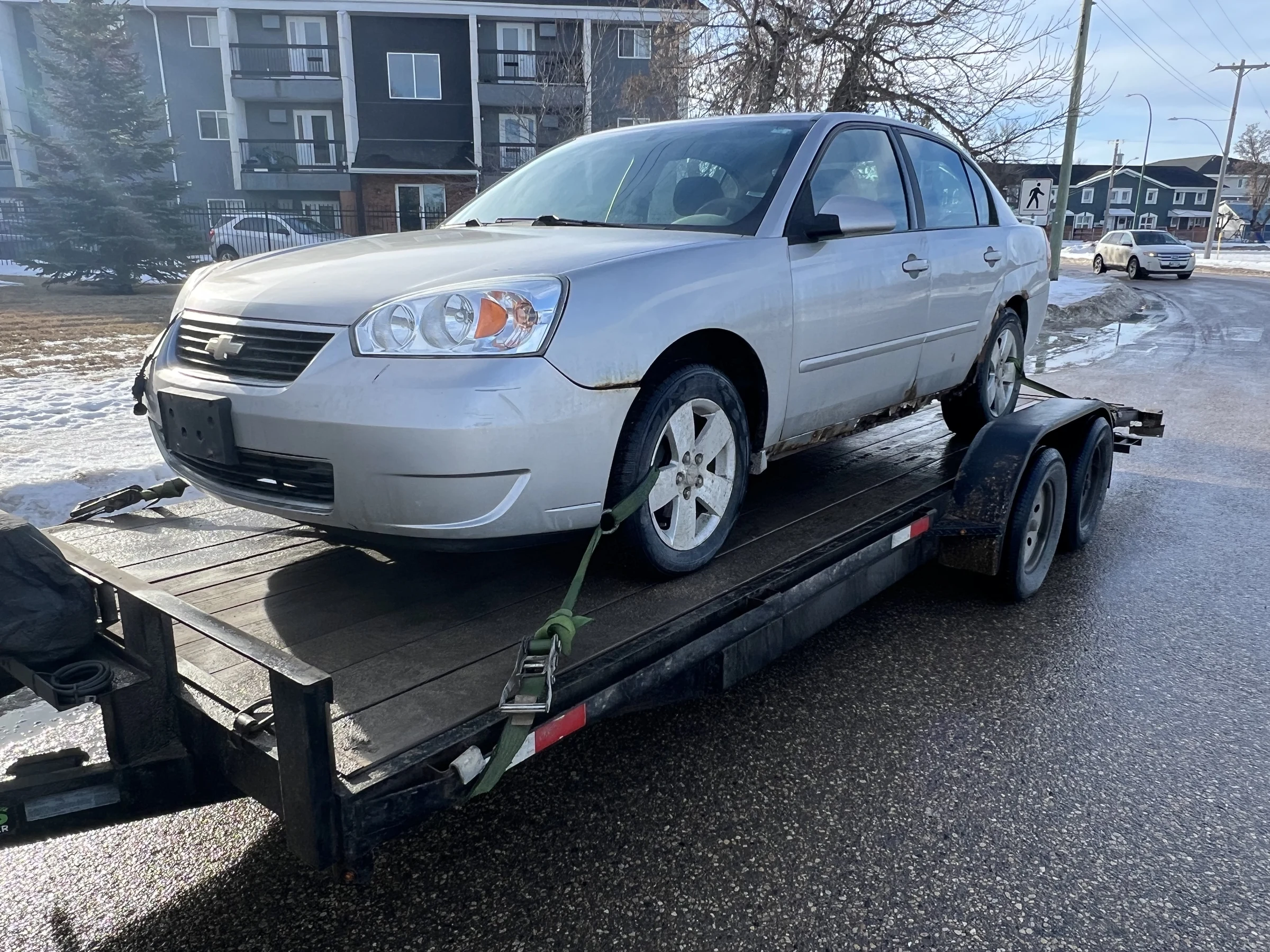Silver Car on Trailer